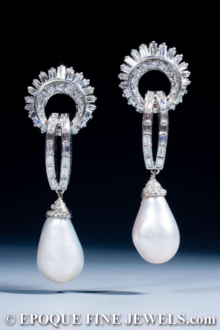 An exquisite pair of natural pearl and diamond earrings